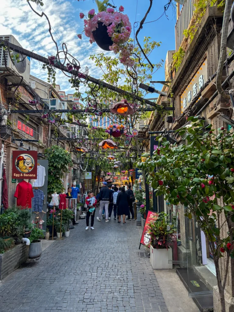 A lively street with small shops in Tianzifang, Shanghai.
